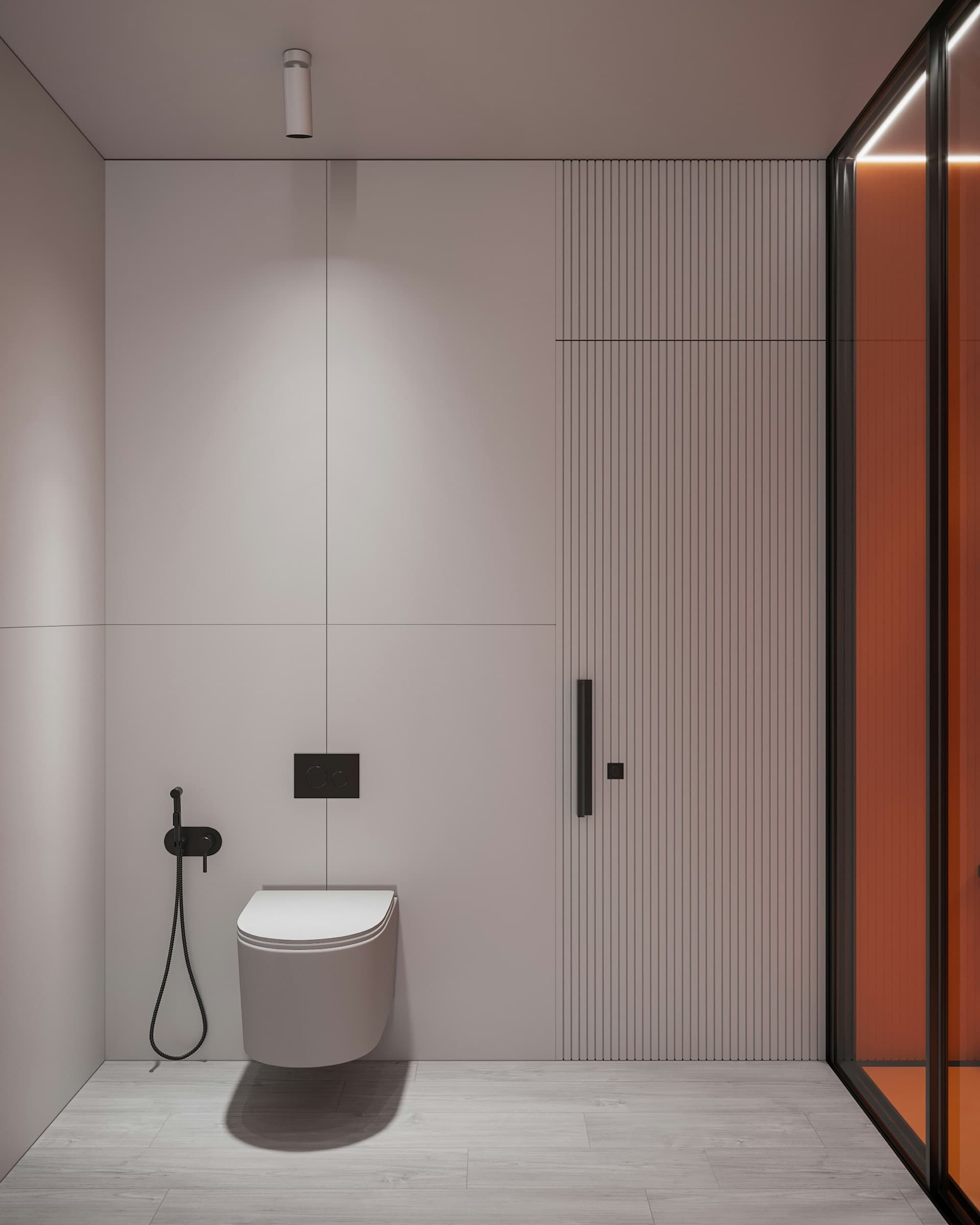 Minimal toilet area with wall-hung WC and concealed flush plate