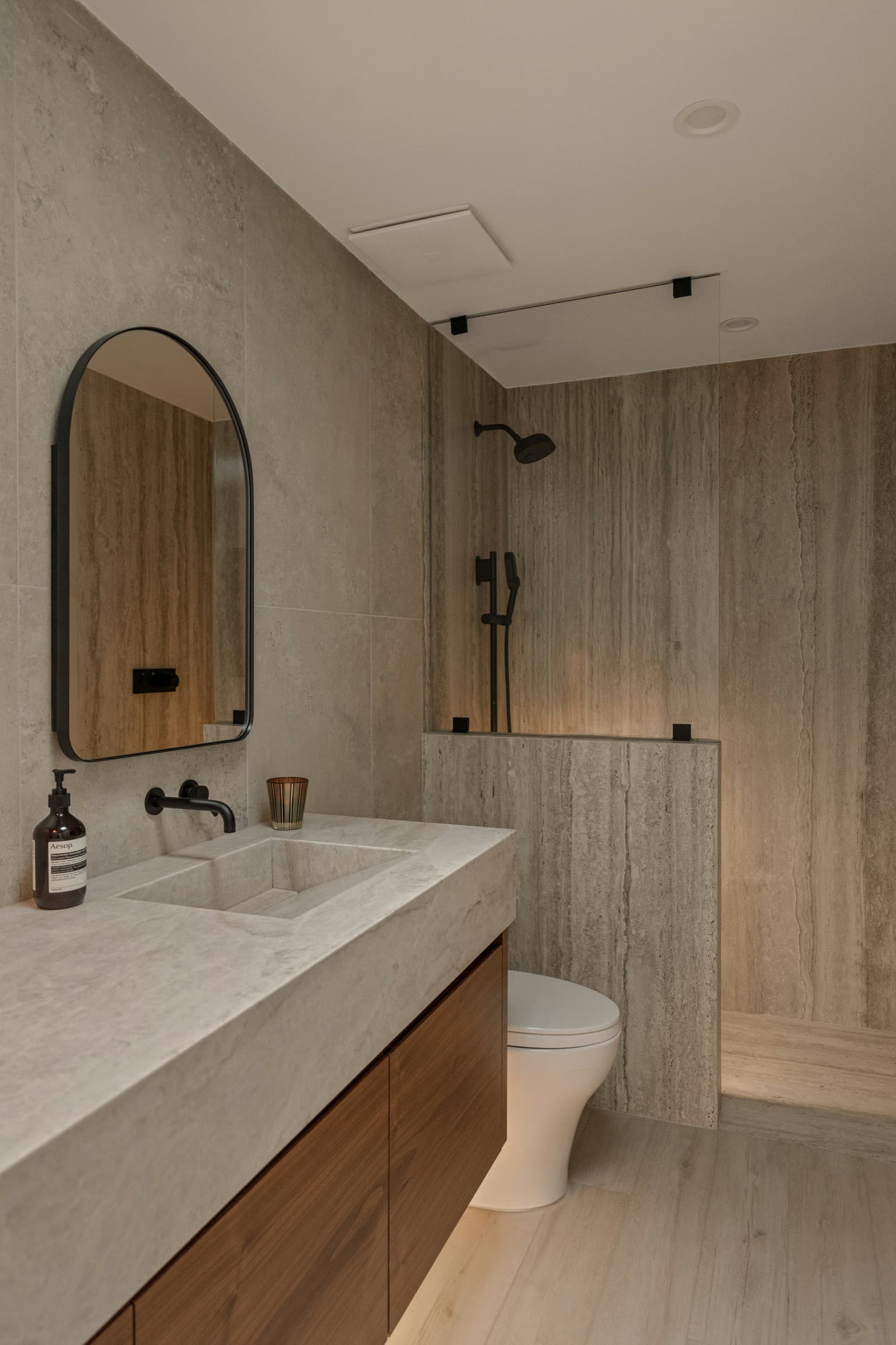 Renovated bathroom with vanity, mirror and walk-in shower