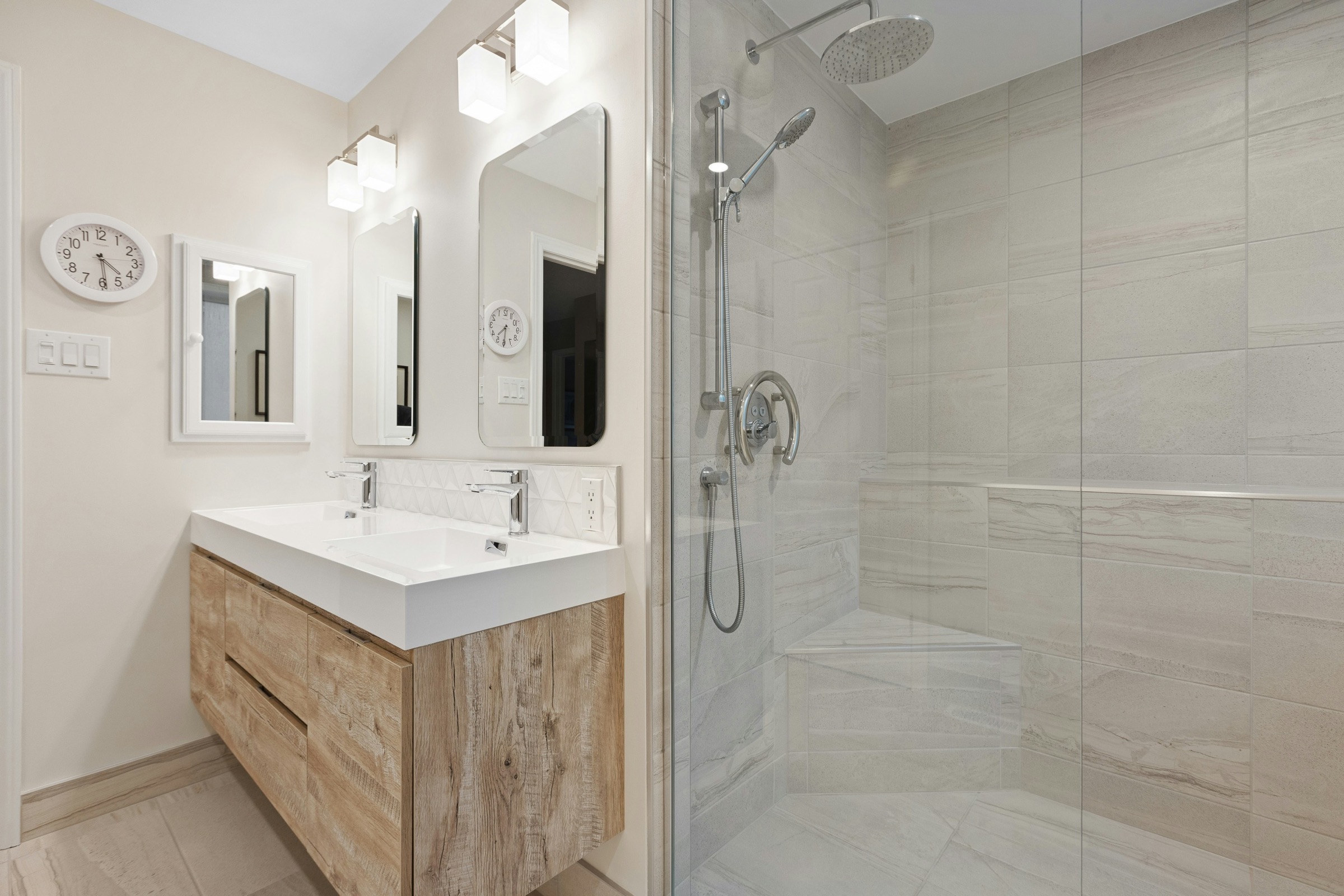 Bright bathroom with glass shower enclosure and timber vanity