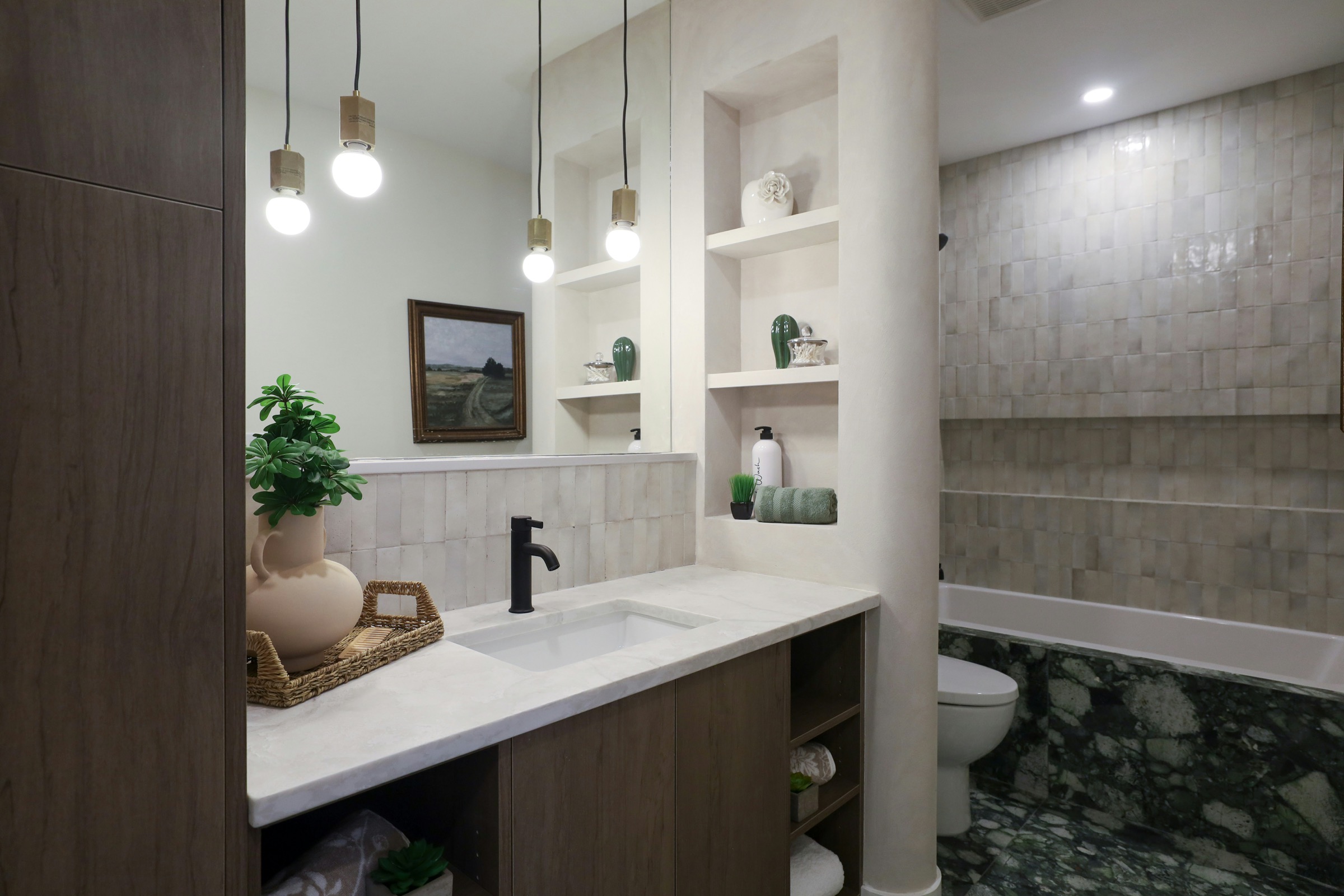 Modern bathroom vanity with basin, pendant lights and display shelves
