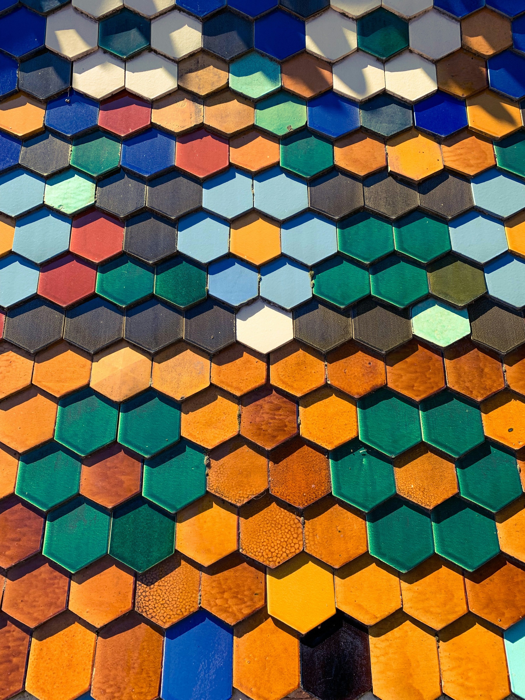 Colorful geometric wall tiles in a premium tile display